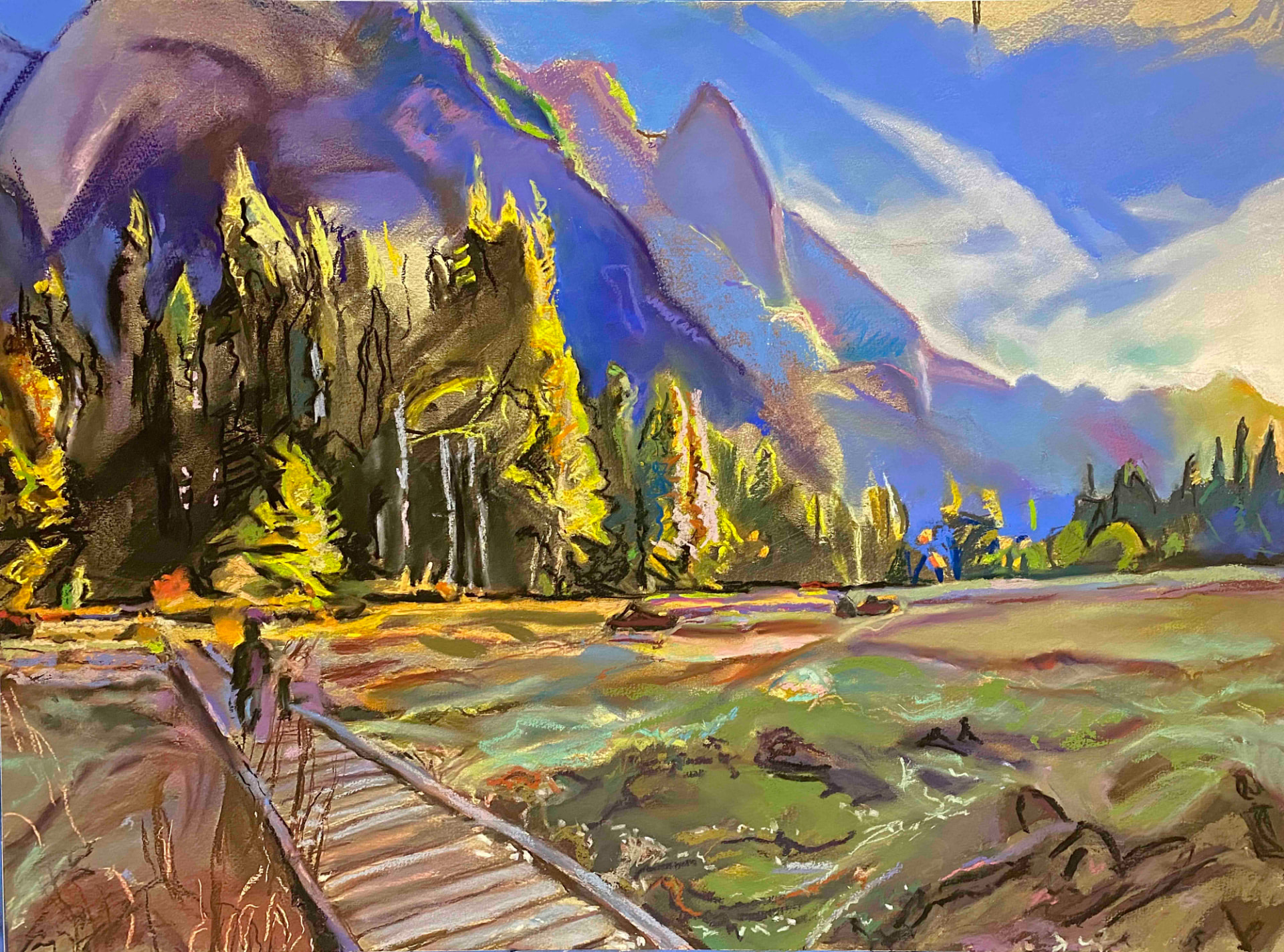 Yosemite Valley with violet cliffs, golden trees, a green meadow and a wooden boardwalk in the foreground