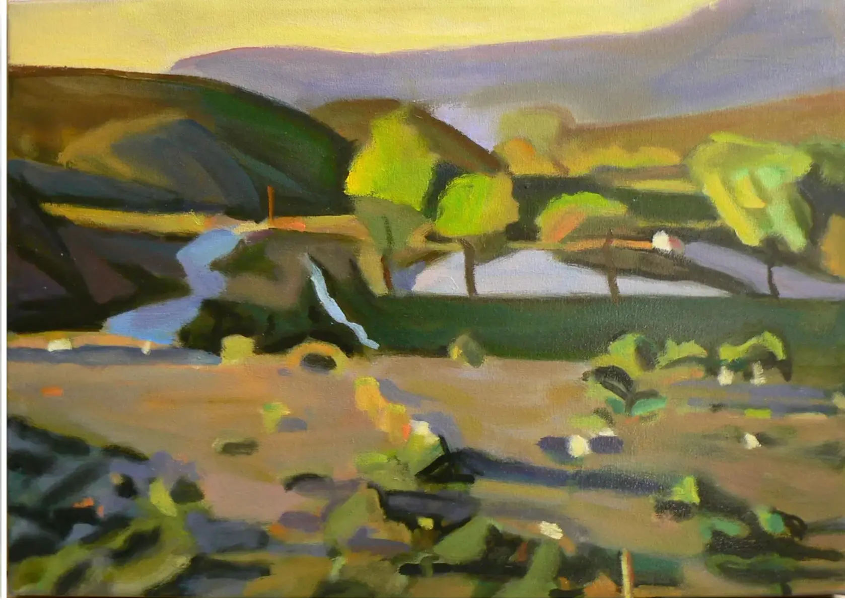 Oil painting of rolling hills and lavender mountains under a pale gold sky, with bright green trees, a stream on the left and a small white cottage with a red roof